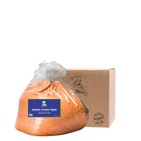 Bag of Adobo Creole Style seasoning with a branded box on a white background