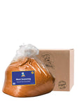 Bag of meat seasoning with a cardboard box labeled 'Merito' on a white background