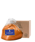 Bag of meat seasoning with a cardboard box labeled 'Merito' on a white background